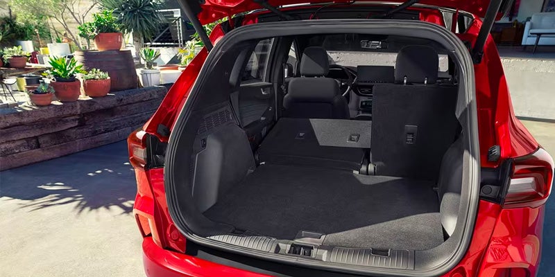 open hatchback interior of red 2024 ford escape plug-in hybrid