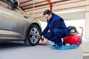 Mechanic putting air in tire | Lanham, MD