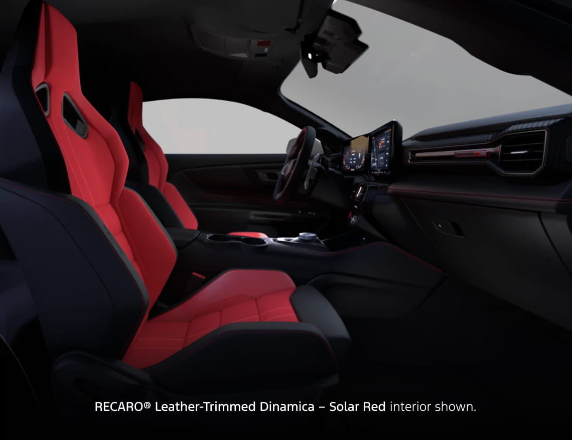 Ford Mustang interior featuring red and black RECARO seats, digital displays, and center console.