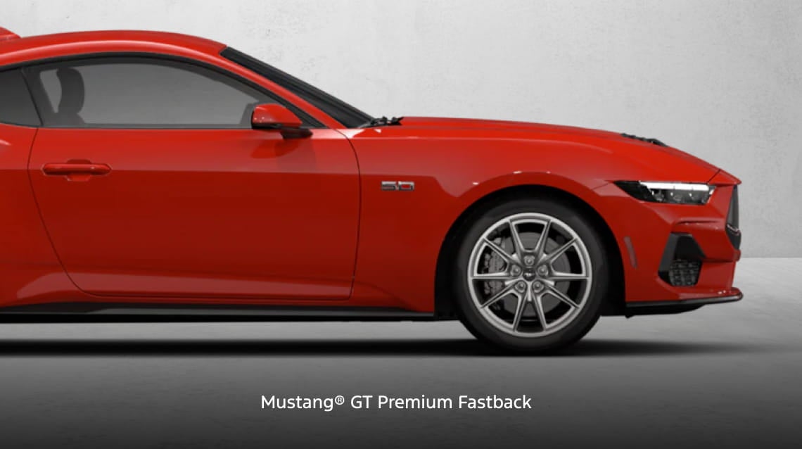 Red Ford Mustang GT Premium Fastback shown from the side.